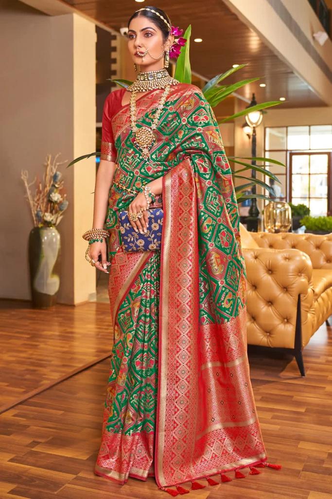 Classy Dark Green Patola Silk Saree with Extraordinary Blouse Piece