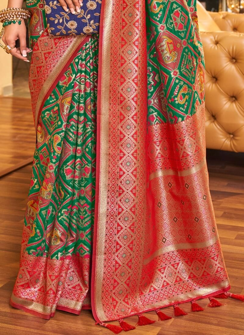 Classy Dark Green Patola Silk Saree with Extraordinary Blouse Piece