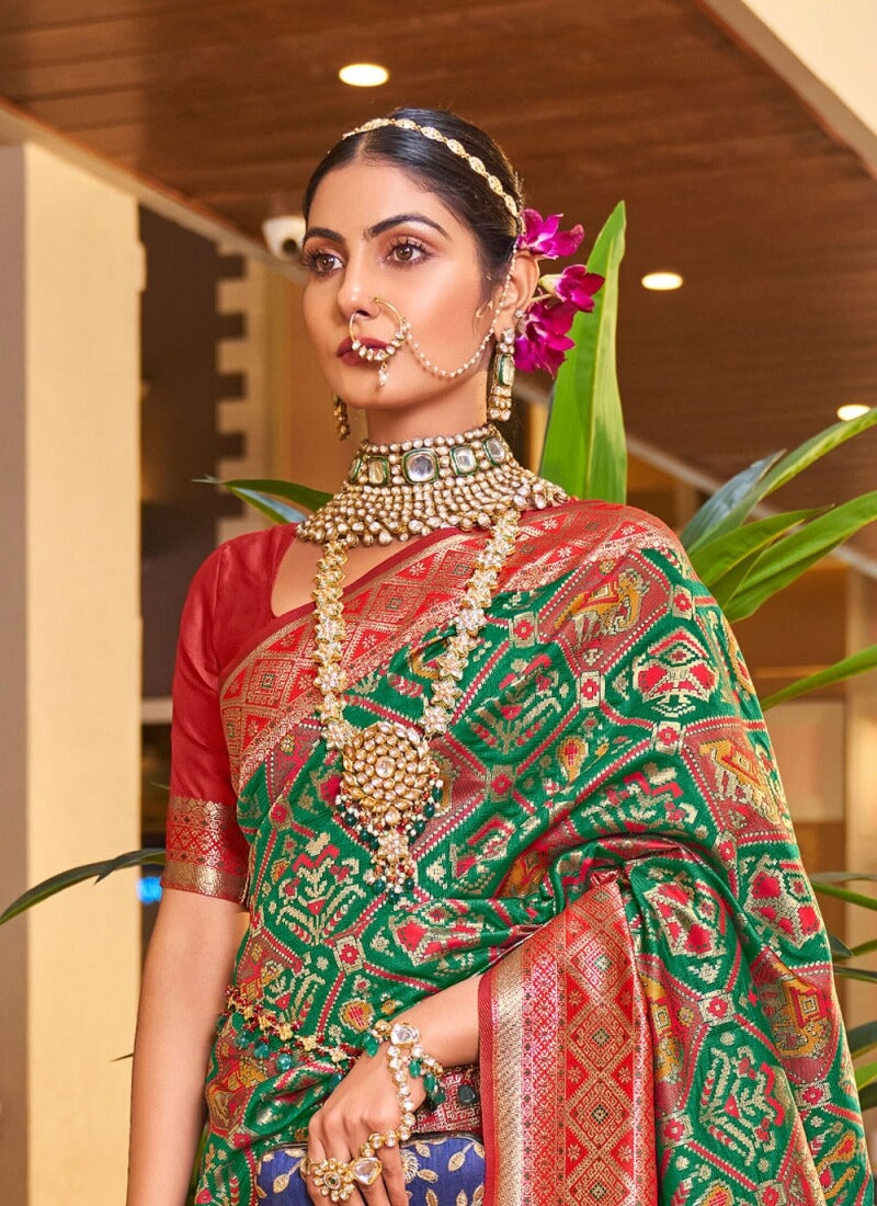 Classy Dark Green Patola Silk Saree with Extraordinary Blouse Piece