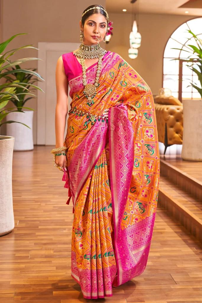 Lovely Orange Patola Silk Saree with Sensational Blouse Piece