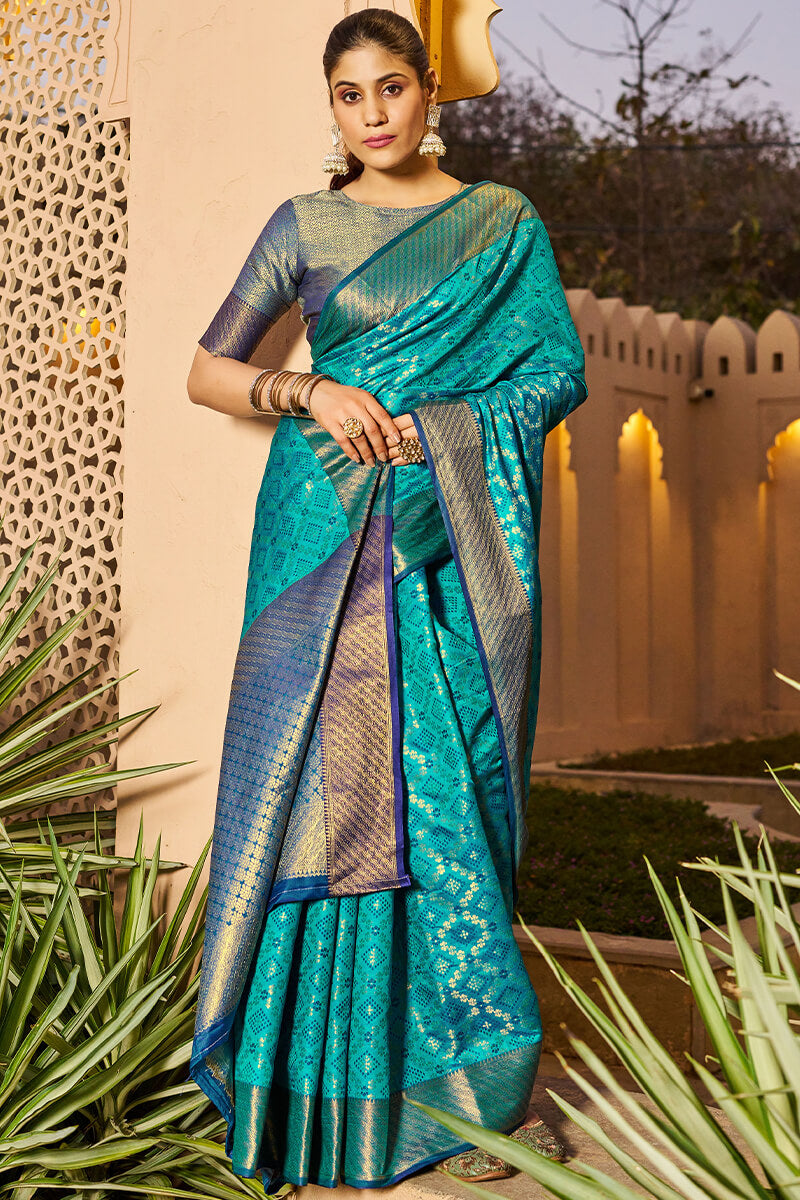 Mesmerising Firozi Patola Silk Saree with Precious Blouse Piece