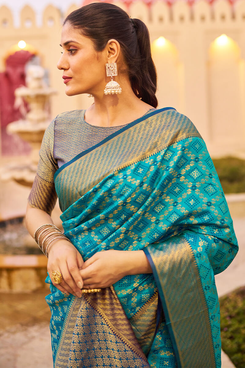 Mesmerising Firozi Patola Silk Saree with Precious Blouse Piece