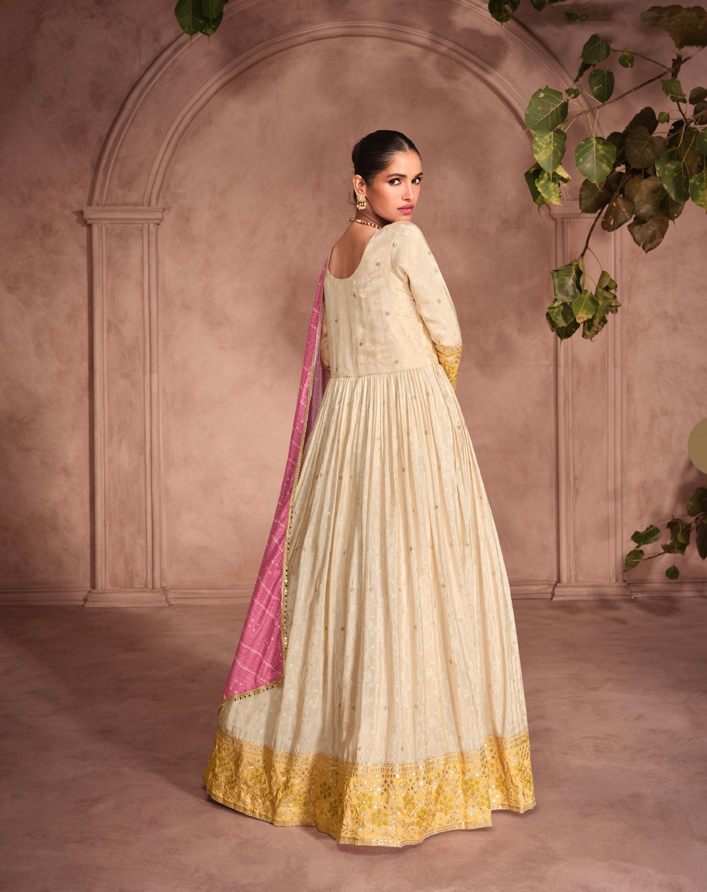 Cream Anarkali Suit with Golden Embroidery and Pink Bandhani Dupatta