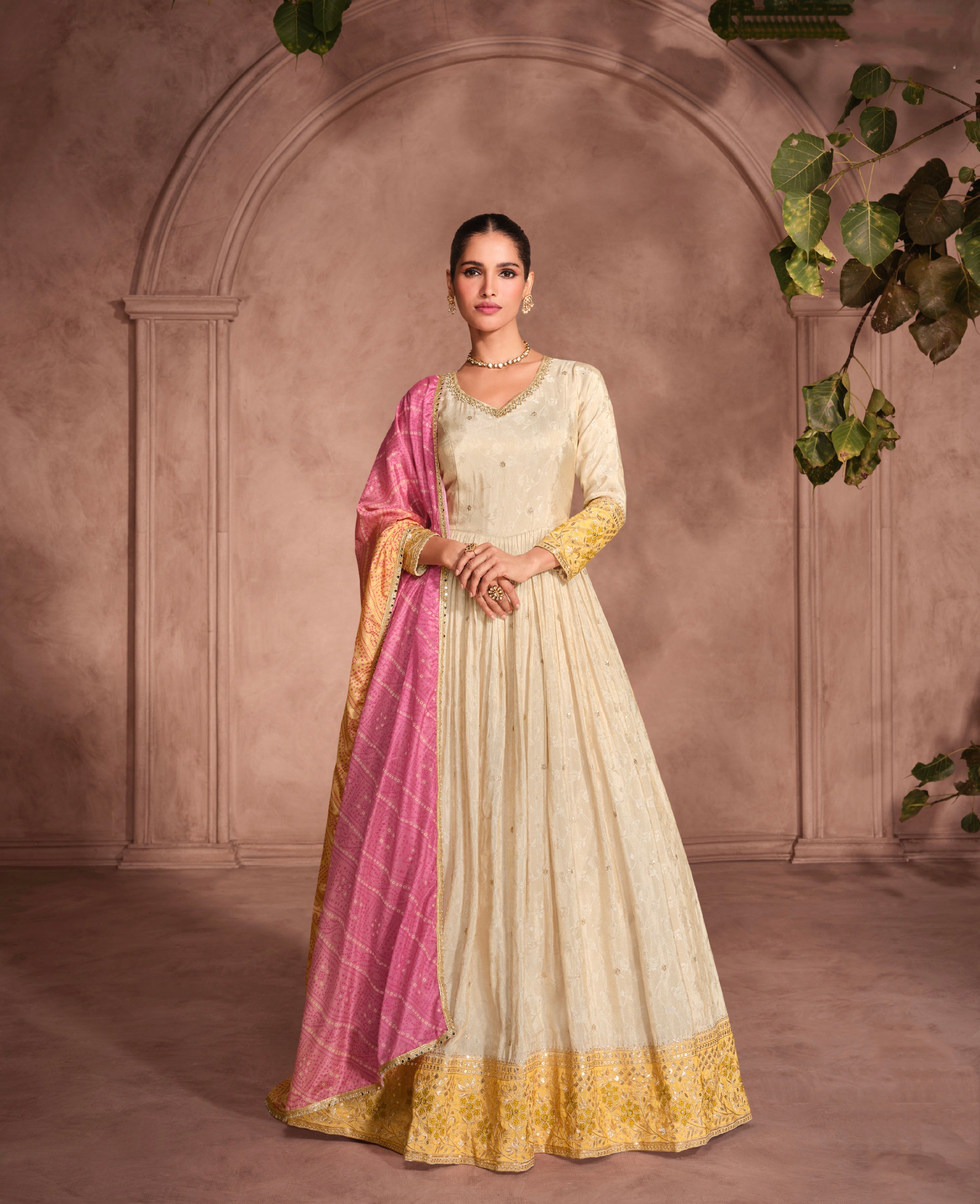 Cream Anarkali Suit with Golden Embroidery and Pink Bandhani Dupatta