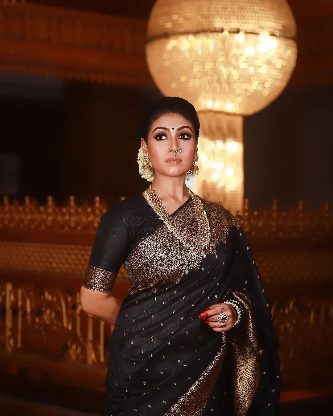 A dreamy Black Soft Banarasi silk saree With Lissome Blouse Piece