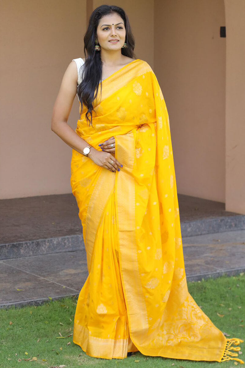 Demanding Yellow Soft Banarasi Silk Saree With Adorable Blouse Piece