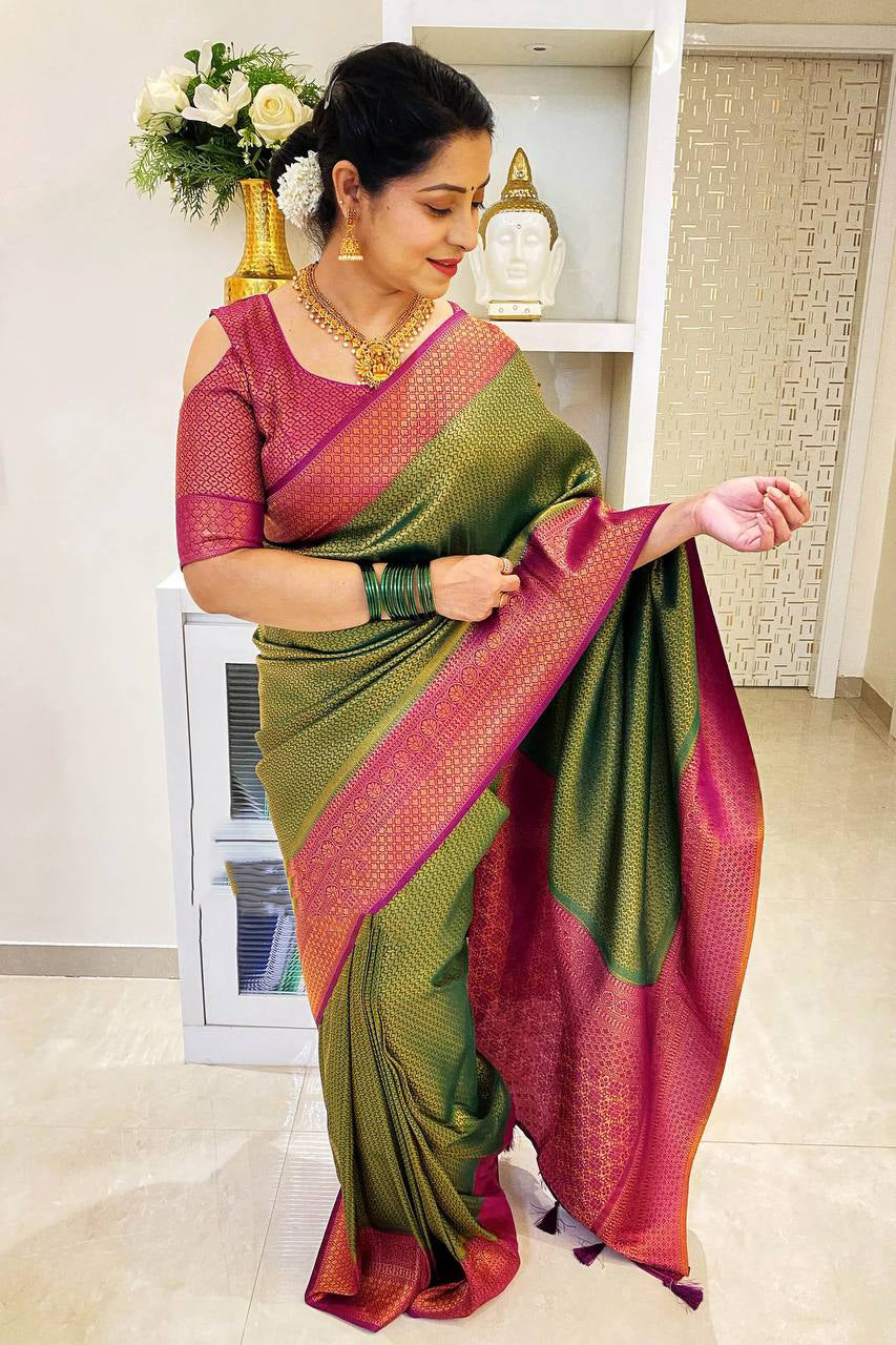 Adoring Green Soft Silk Saree With Cynosure Blouse Piece