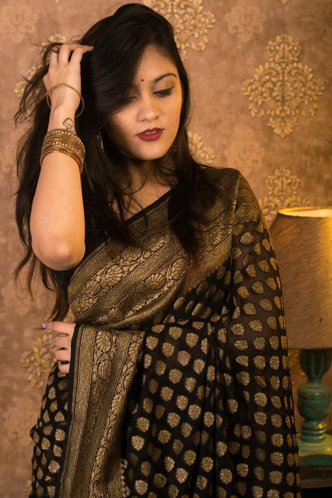 Dazzling Black Soft Banarasi Silk Saree With Gleaming Blouse Piece