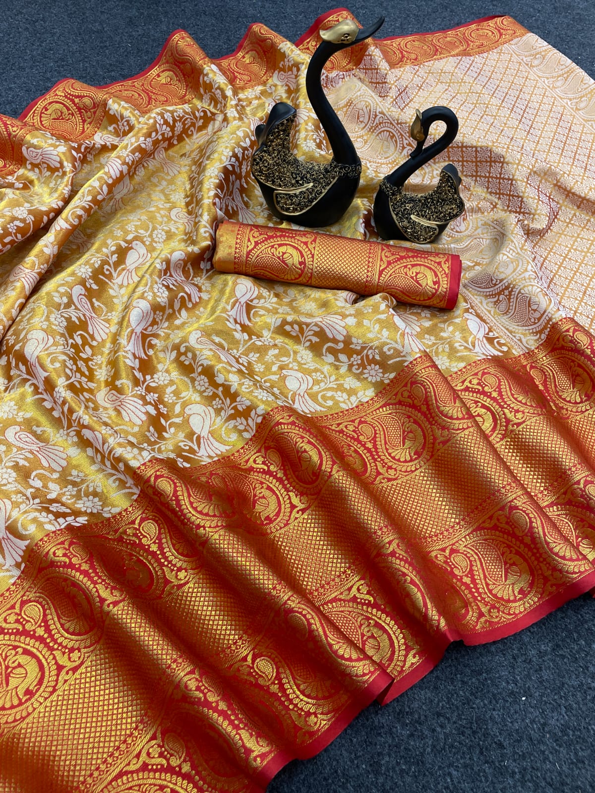 Adorning Red Kanjivaram Silk Saree With Gleaming Blouse Piece