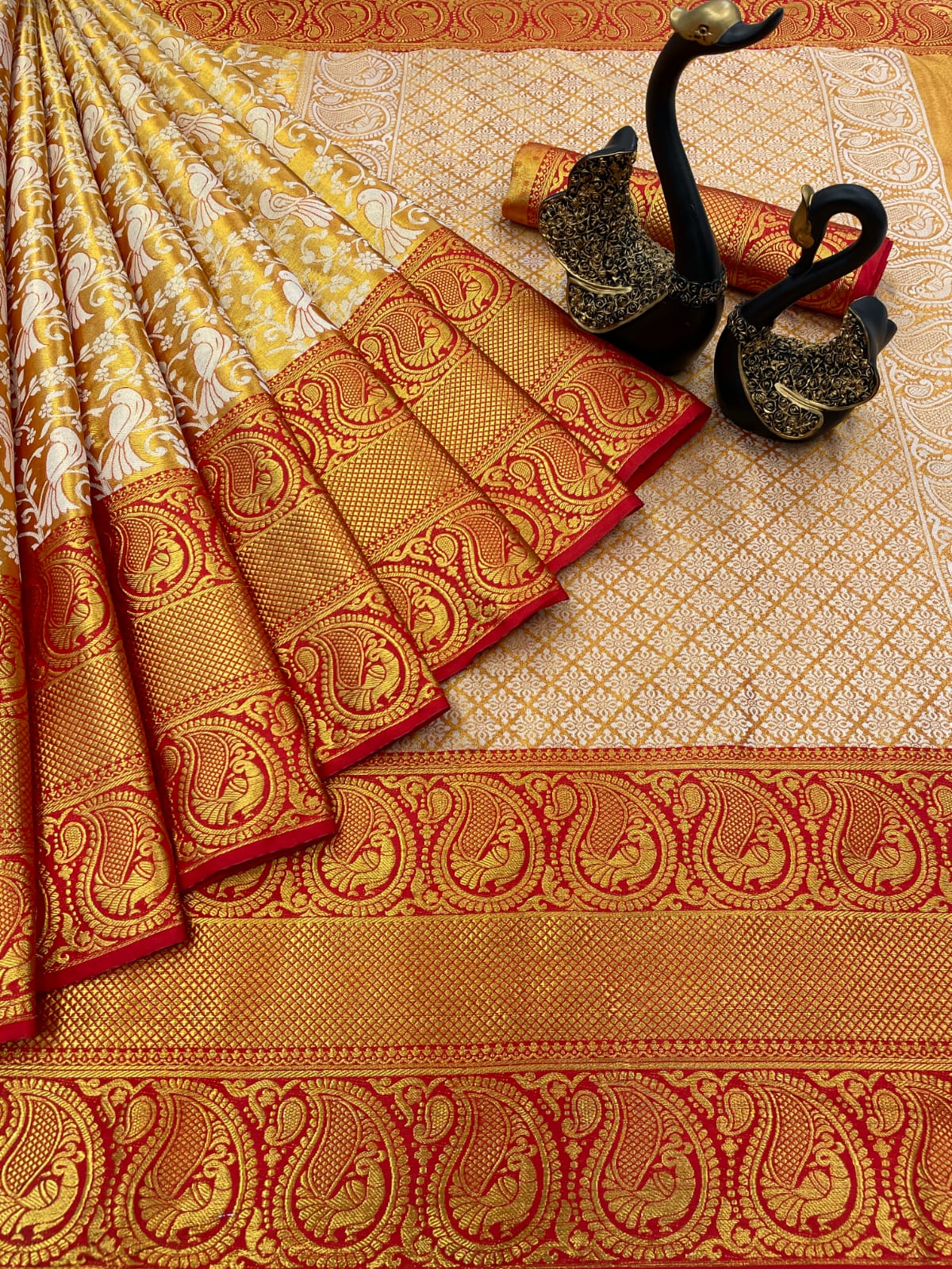 Adorning Red Kanjivaram Silk Saree With Gleaming Blouse Piece