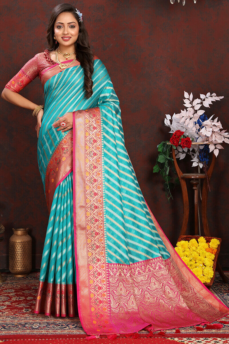 Enticing Firozi Soft Banarasi Silk Saree With Twirling Blouse Piece