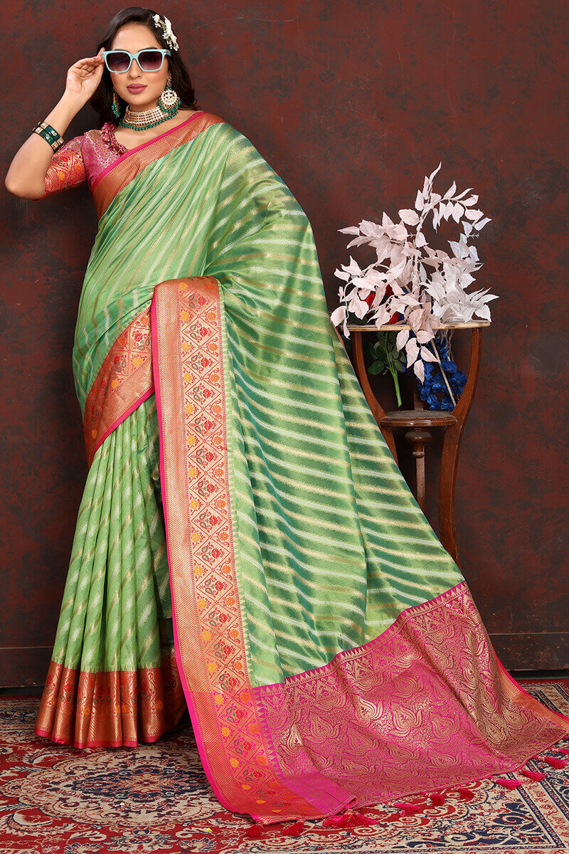 Dazzling Pista Soft Banarasi Silk Saree With Sizzling Blouse Piece