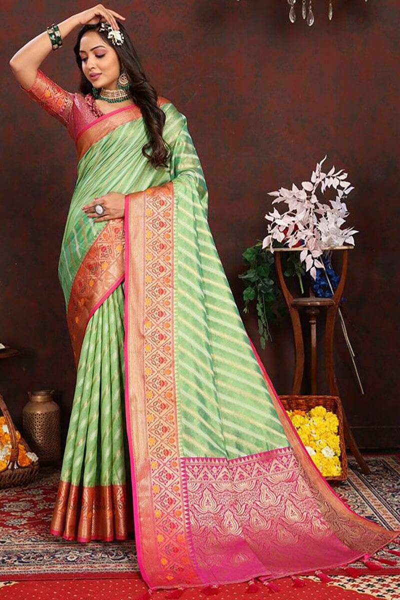 Dazzling Pista Soft Banarasi Silk Saree With Sizzling Blouse Piece