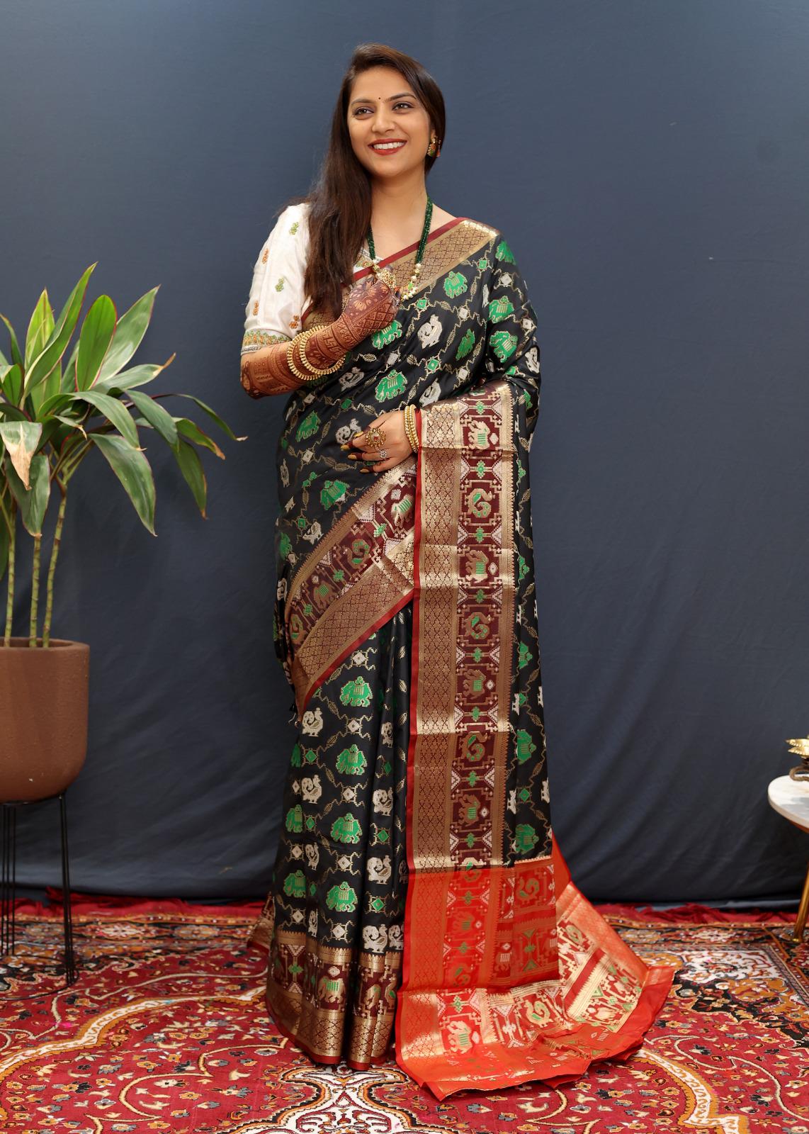 Magnificat Dark Green Patola Silk Saree with Ineffable Blouse Piece