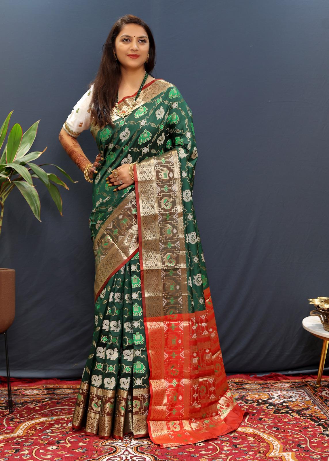 Magnificat Dark Green Patola Silk Saree with Ineffable Blouse Piece