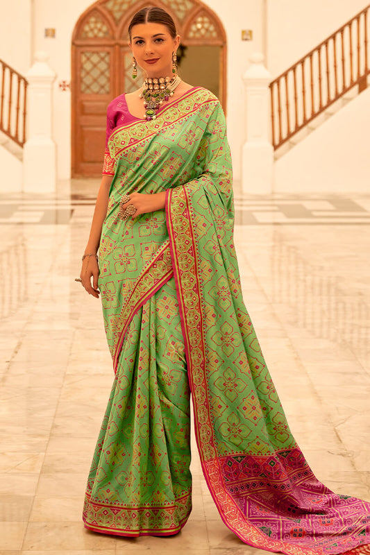 Deserving Pista Patola Silk Saree with Surpassing Blouse Piece