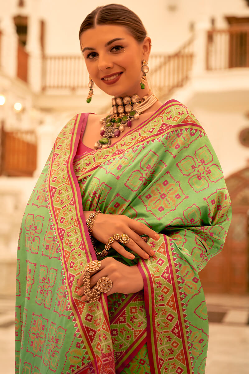 Deserving Pista Patola Silk Saree with Surpassing Blouse Piece