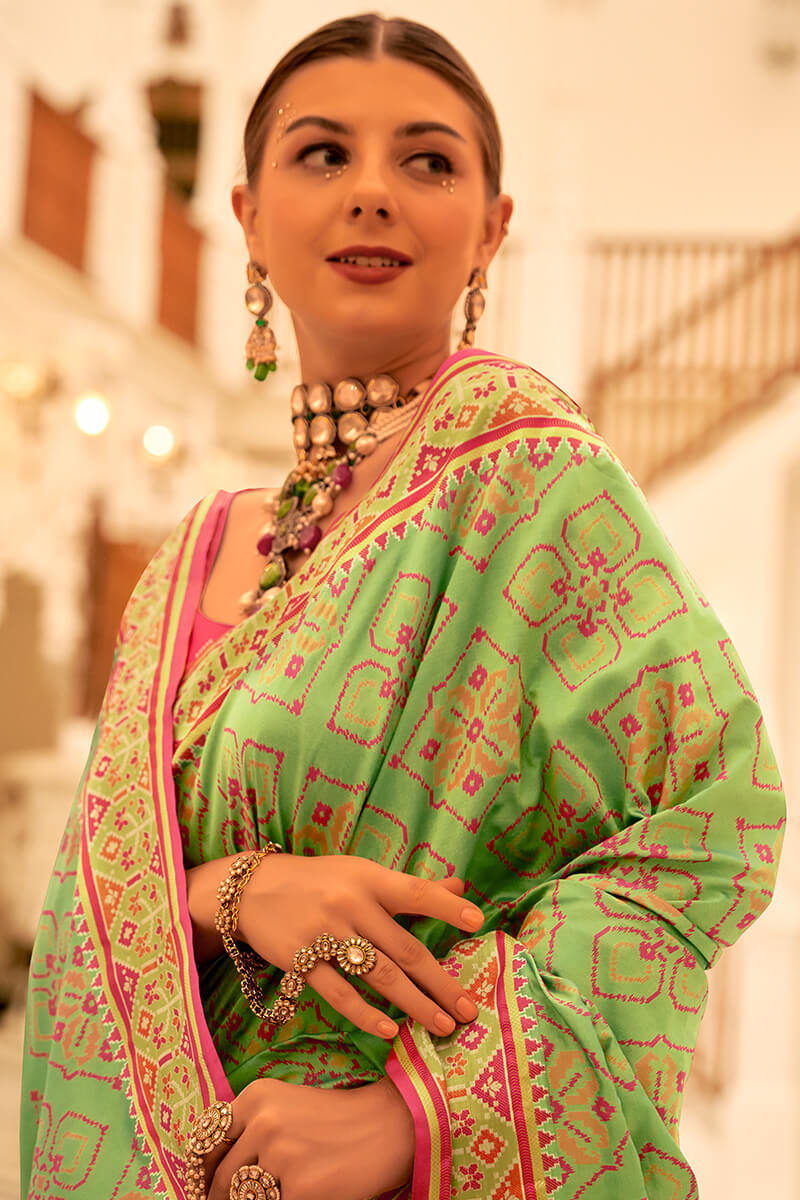 Deserving Pista Patola Silk Saree with Surpassing Blouse Piece