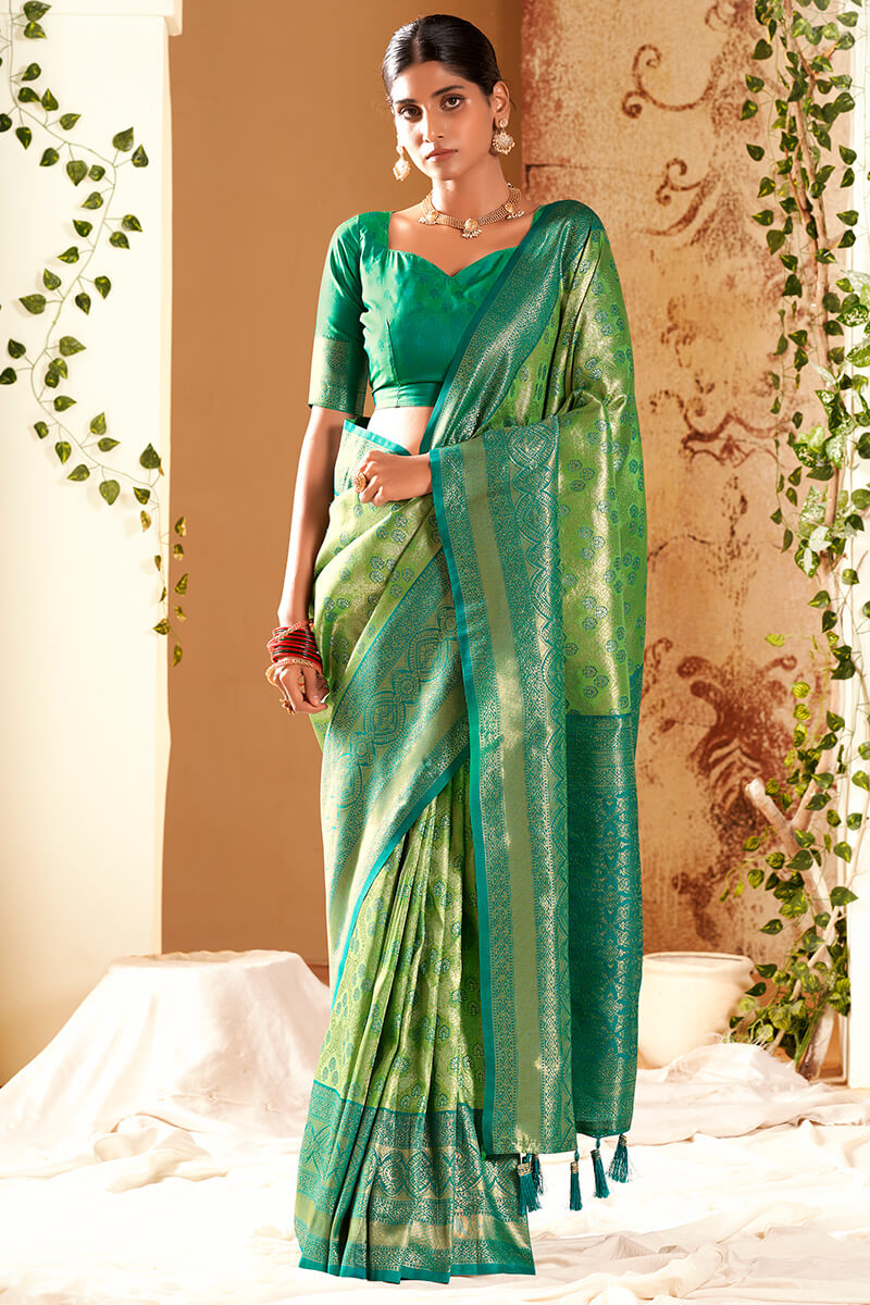 Alluring Green Kanjivaram Silk Saree With Resonant Blouse Piece