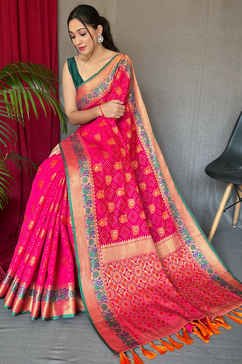 Lassitude Dark Pink Patola Silk Saree with Staggering Blouse Piece