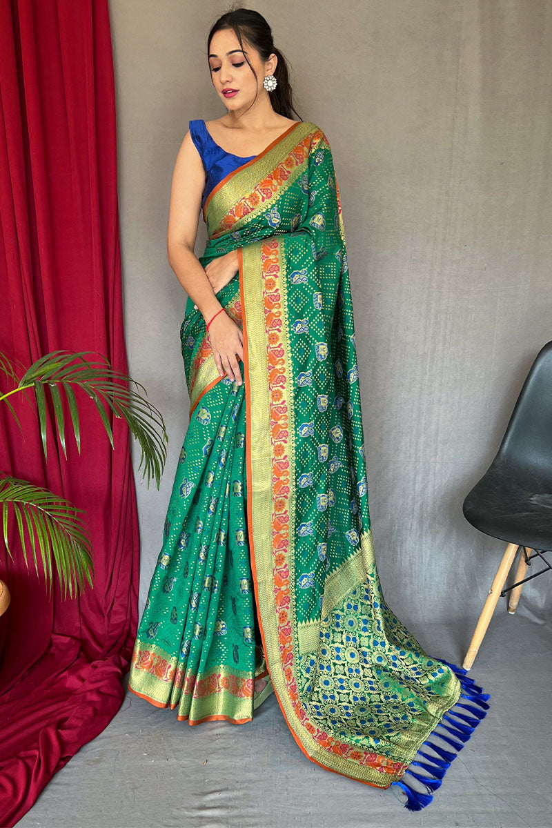 Delectable Green Patola Silk Saree with Propinquity Blouse Piece