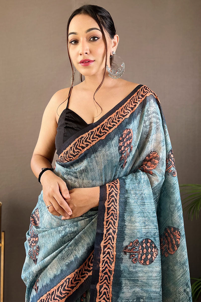 Adoring Firozi Digital Printed Tussar Silk Saree With Radiant Blouse Piece