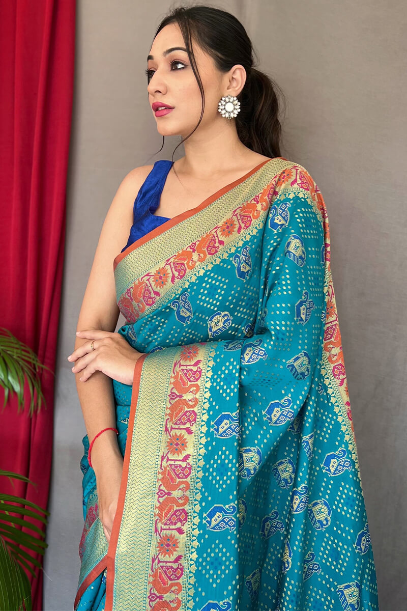 Demanding Firozi Patola Silk Saree with Desiring Blouse Piece