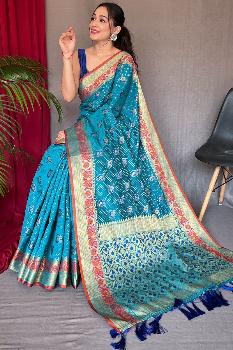 Demanding Firozi Patola Silk Saree with Desiring Blouse Piece