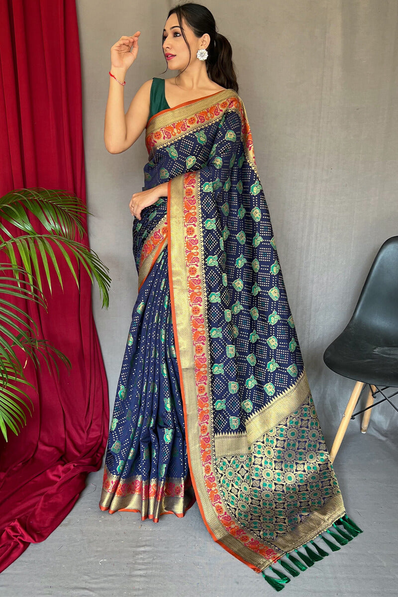 Beauteous Navy Blue Patola Silk Saree with Chatoyant Blouse Piece