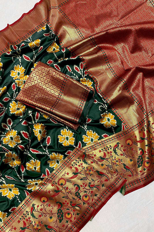 Adorning Dark Green Patola Silk Saree with Deserving Blouse Piece